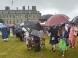 A sea of umbrellas on the Palace Lawns